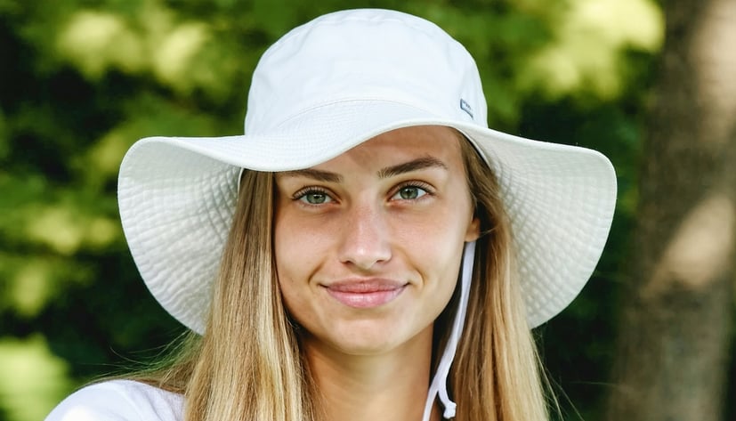 LadyBuckets wide-brimmed bucket hat showcasing sun protection feature LadyBuckets wide-brimmed bucket hat showcasing sun protection feature